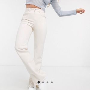 White jeans with split hem